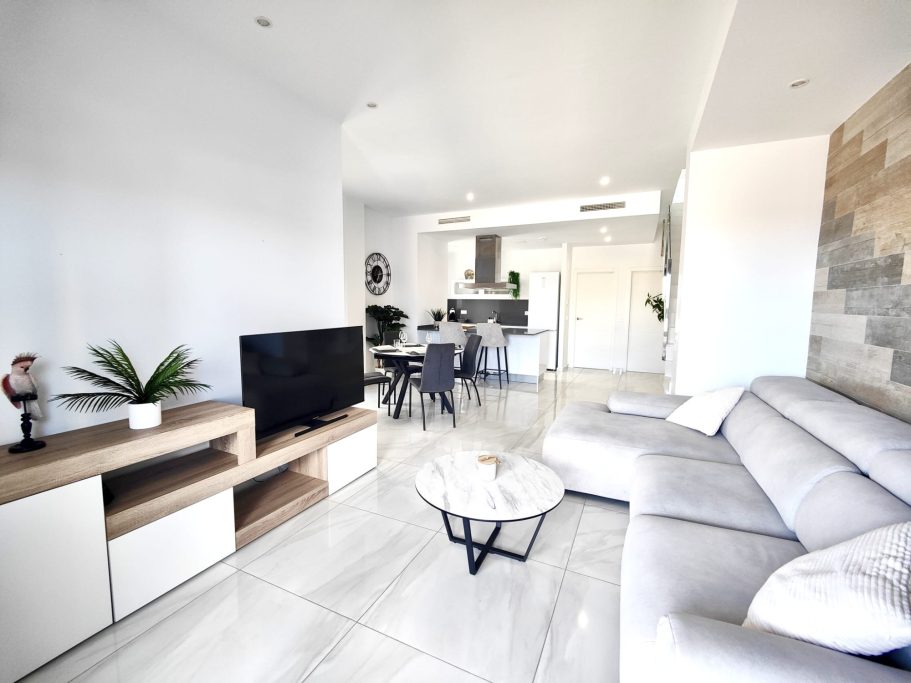 Salon moderne avec grand canapé dans pièce de vie ouverte - villa de luxe Polop Collection Signature